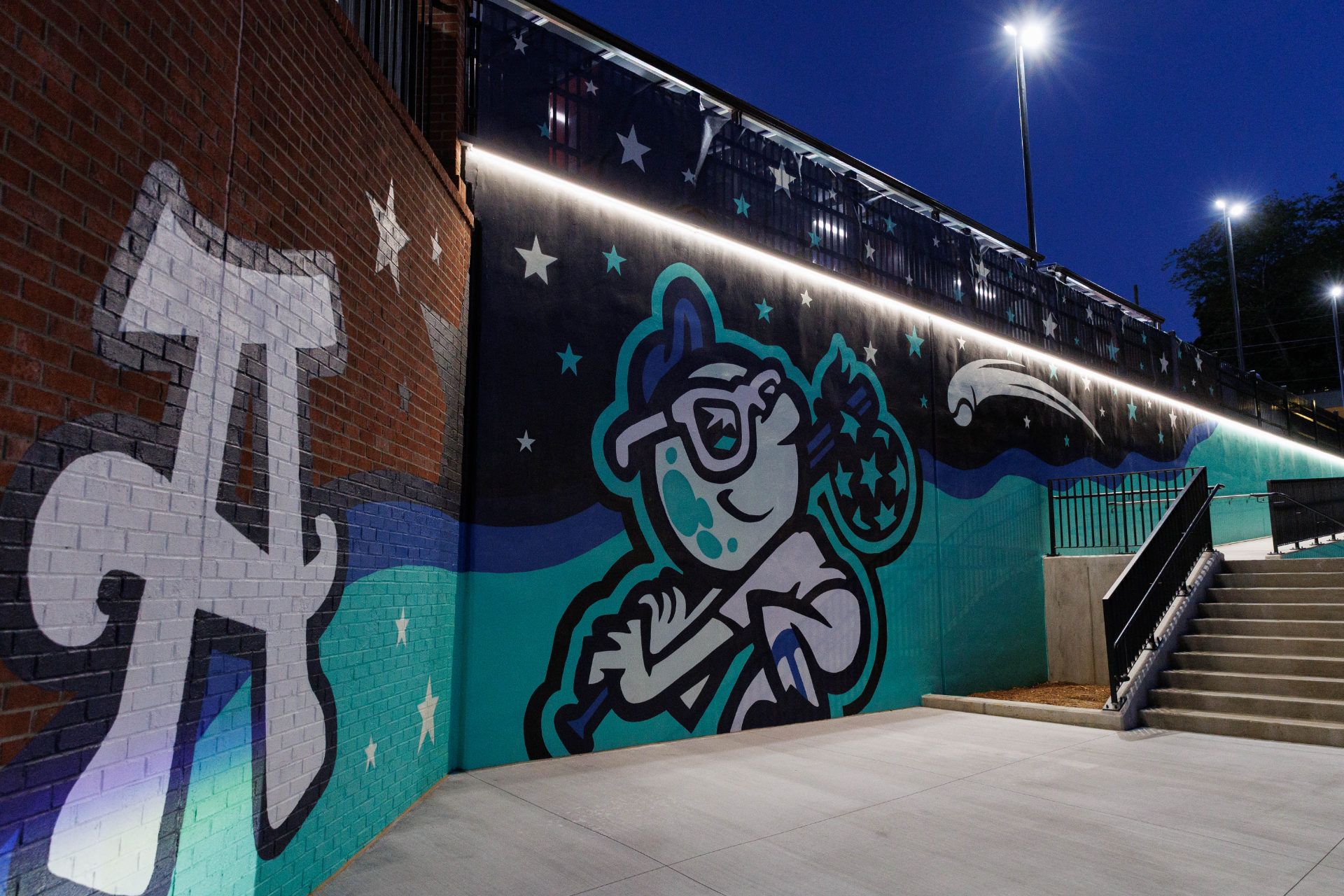 Tourists mural by stairway